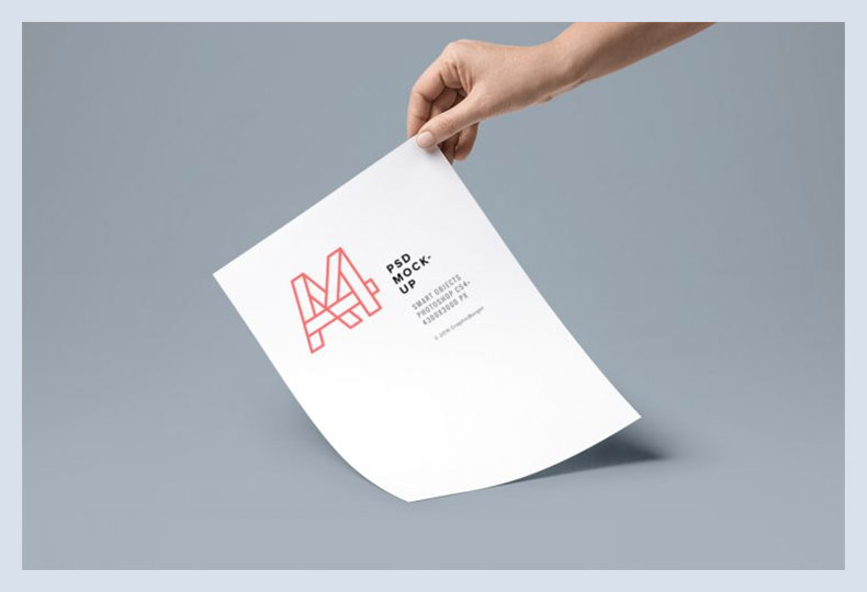 Hand Holding A4 Flyer Mockup